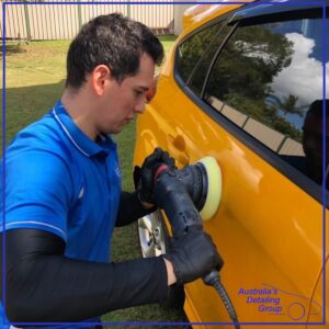 Australia's Detailing Group employee polishing car